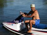 Eddy with the classic "Coors" hat, on a jet ski.  Which is older, the "Coors" hat, or the jet ski?  You decide.