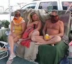 Waiting out the sandstorm.  Jean with her ski goggles, Anne with her sarong, and Rennie with his well placed beer.