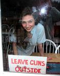 Dana asks her customers to please "Leave Guns Outside."