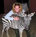 Cherie bonds with a baby zebra.