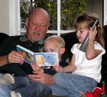 "Grandpa" reads a book to Tanner while Ellie chats on the phone.  (There is so much to say when you are 4-years-old!)