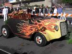 Now that's one pretty hot-rod. Flowers of fire are ready to tear down the street.