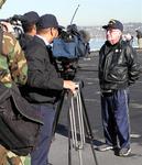 News crews cover the historic event.  Midway will be the nations largest aircraft-carrier museum.