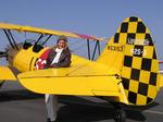 Cherie spends the day buzzing around LA, flying a 1940 Stearman with pilot Gabe Lopez. *Photo by Norm