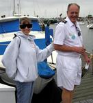 American Legion Yacht Club's John Hamilton leads Kim down the dock at the 15th Annual Sail for the Blind and Visually Impaired.