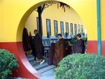 Monks walk into the temple.