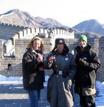 Scott and Cherie drinking red wine on the Great Wall with a Chinese guard named Wow.