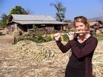 Jean (who used to play the flute) tries her hand at playing sugar-cane.
