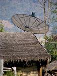 A satellite-dish on a shack.