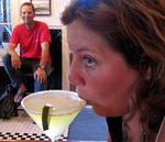 Greg watches as Anne sips her Key Lime Pie Margarita (the glass is dusted with graham cracker crumbs instead of salt.)