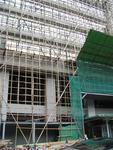 Modern buildings are repaired with bamboo scaffolding.