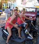 The two Wilmas on mopeds.