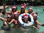 Celebrating Christmas 2005 at the Whitsundays.  In the pool at Club Croc in Long Island, we splash around in our Santa hats.