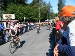 Crowds gather along the bike route and root for the racers.