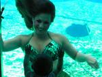 Mermaid Marci's daugher recognizes her even under water. Photo by John Athanason. 