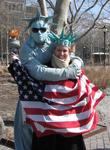 Cherie gets a giant "Liberty-sized" hug from one of mime-statues in Battery Park.