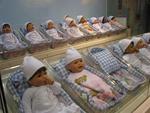 These life-like babies are waiting at the FAO Schwartz "Nursery Adoption Center."