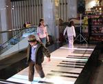Future musicians entertain themselves (and their parents) on this king-sized keyboard.