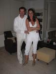 Erik and Claudia dressed in white.