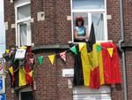 People hanging out of their windows to watch the Tour de France 2007.