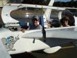 "Rocky", the flying squirrel, presents pilot Greg and passenger Cherie.