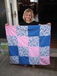 Ellie with her first quilt.