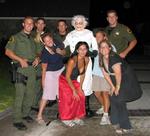 Karem, Hallie, Lisa and I with four officers and the Monster-Thief.