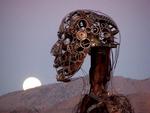 A steel figure watches the moon set at dawn. *Photo by Cherie Sogsti