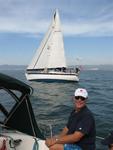 Skipper Charlie with Charissa, a Peterson Liberty 458 in the distance.  