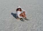Cherie sitting in the middle of Badwater, Death Valley, the lowest point in the Western Hemisphere.