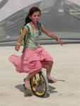 This little girl can hydrate and ride a unicycle simultaneously.