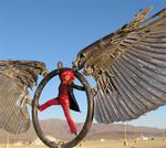 Cherie during a morning soar in the Black Rock Desert on "Spread Eagle", by artist Bryan Tedrick.