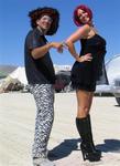 Wearing our fabulous desert outfits at Burning Man.