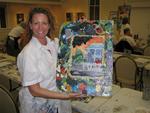 Cherie and her painting of a local Key West residence.