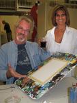 Diane and Theo, owners of Key West's Coffee Plantation, with blank canvases.