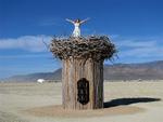 Cherie ready to soar from a nest at Burning Man 2009.