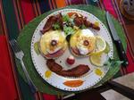 Cherie can't help but play with her food - even if its Charlie's amazing Eggs Benedict breakfast